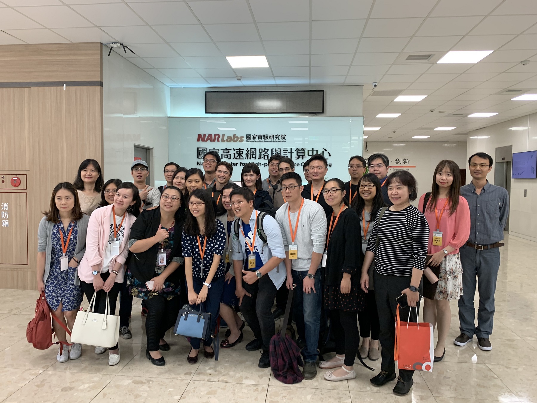All visiting program participants pose inside the NCHC.