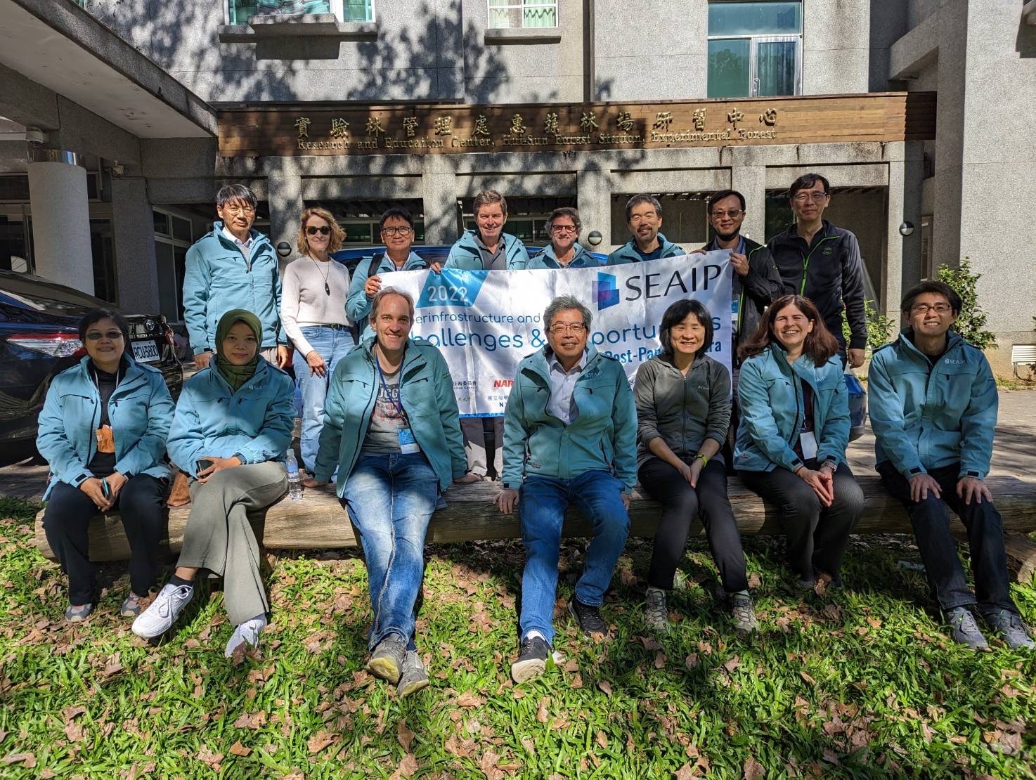 Participants in a group photo at Huisun Forest